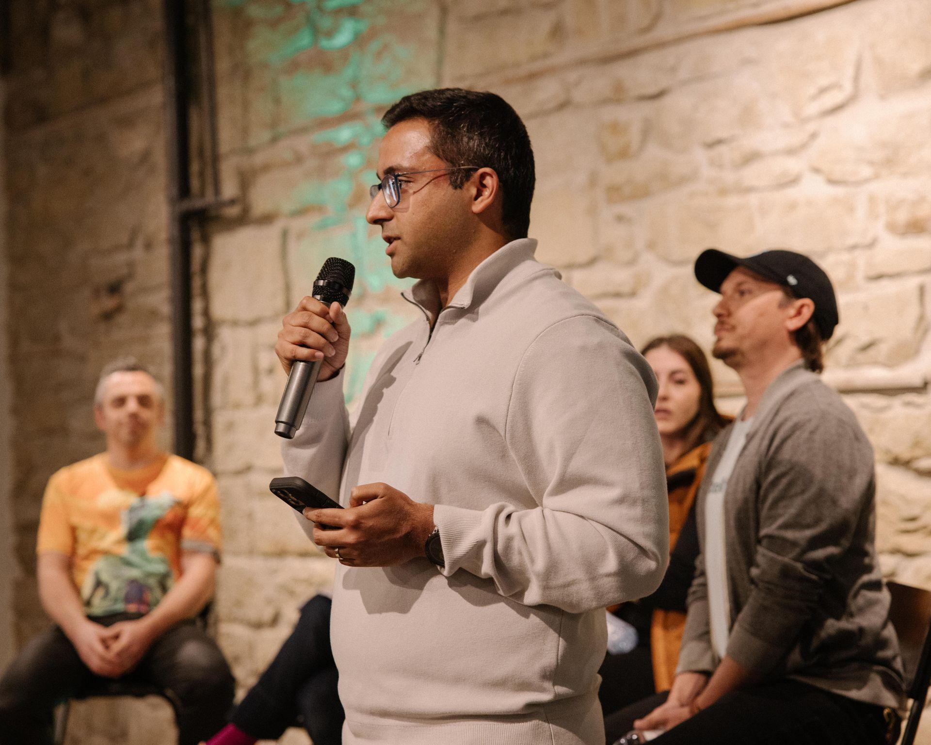 Fahad Zaidi, Engineering Manager at Neo Financial, speaking to the crowd at Tech Thursday in Calgary for an AI panel. 