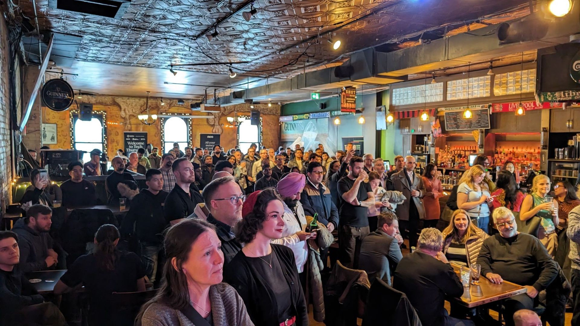 A crowd in Winnipeg watching a Tech Thursday panel. 